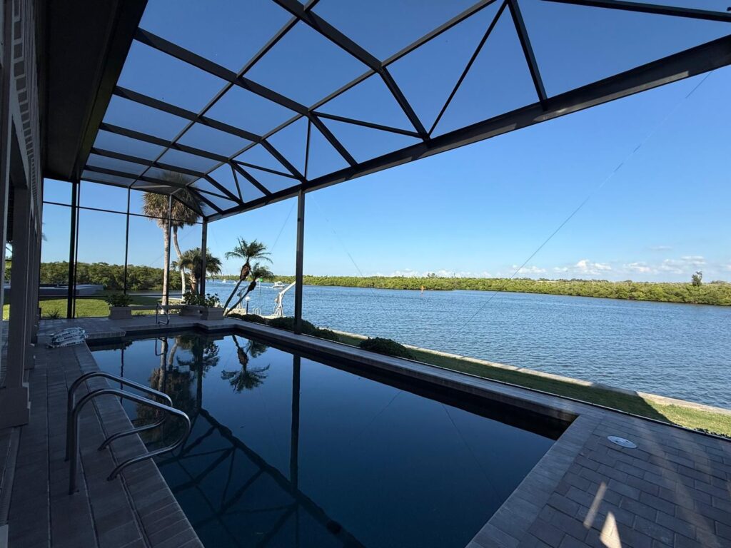 Finished pool screen enclosure with aluminum framing at a Florida home