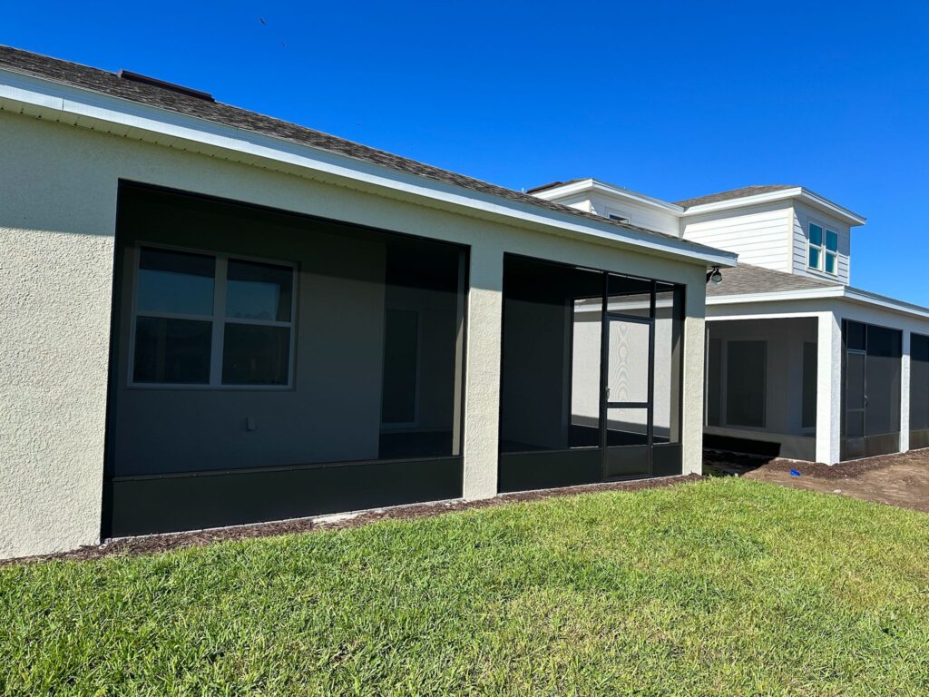 Lanai fill-in screen enclosure installed on a covered patio in Central Florida.