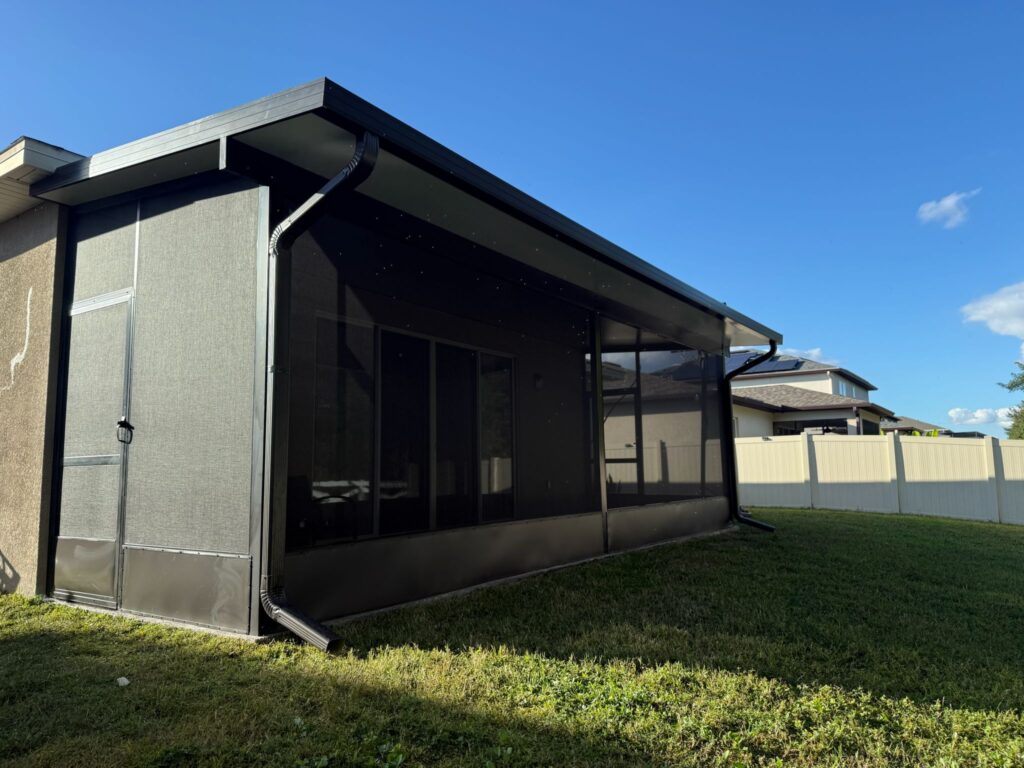 Screen enclosure side view with bronze aluminum frame and kickplate